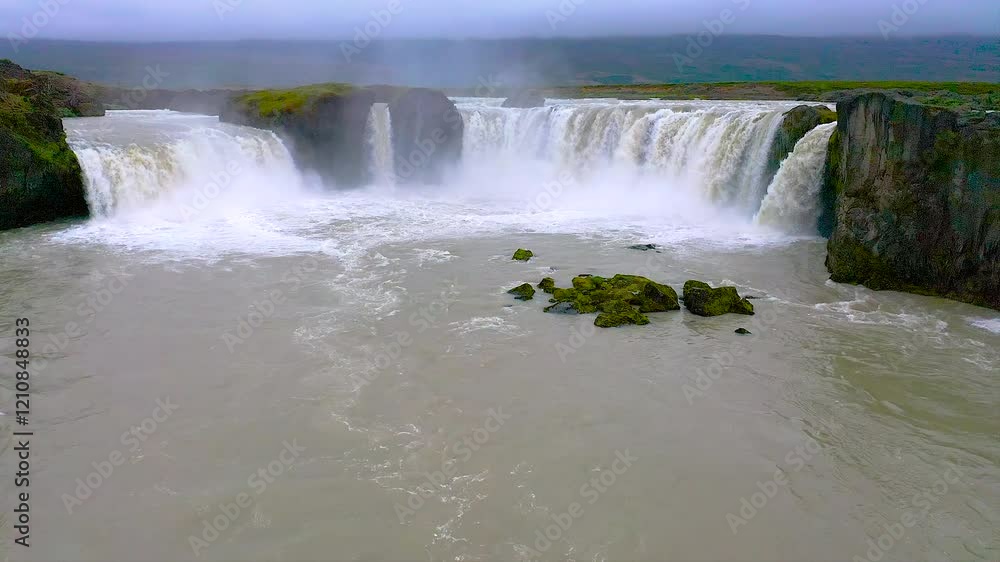 Aerial view of Godafoss waterfall, located along the country's main ring road close to Akureyri. The water of the river Skjalfandafljot falls from a height of 12 metres over a width of 30 metres. Aerial view of Godafoss waterfall, located along the country's main ring road close to Akureyri. The water of the river Skjalfandafljot falls from a height of 12 metres over a width of 30 metres.