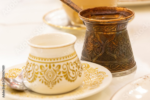 Turkish coffee with cezve and beautiful cup photo