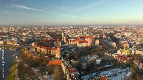 Wawel at sunset, panoramic circular aerial shot in winter.