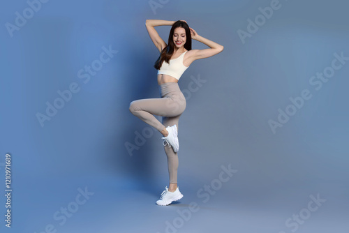 Wallpaper Mural Beautiful woman in stylish sportswear on grey background Torontodigital.ca