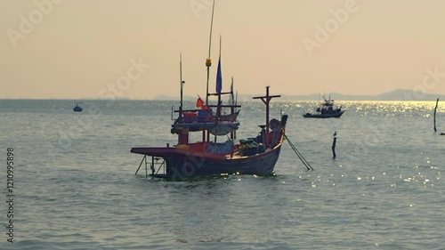 fishing boats at sunset