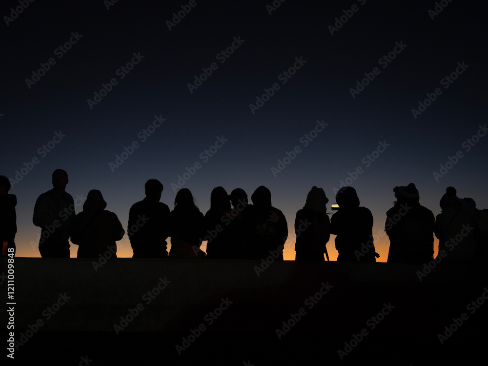 Silhouette of many people and the morning light on the top of Doi Inthanon in Chiang Mai, Thailand.