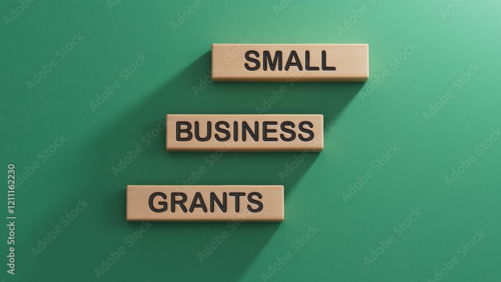 Small Business Grants symbol. Concept words Small Business Grants on wooden blocks.Business and Small Business Grants concept. Copy space.3D rendering on green background. Small Business Grants symbol. Concept words Small Business Grants on wooden blocks.Business and Small Business Grants concept. Copy space.3D rendering on green background.