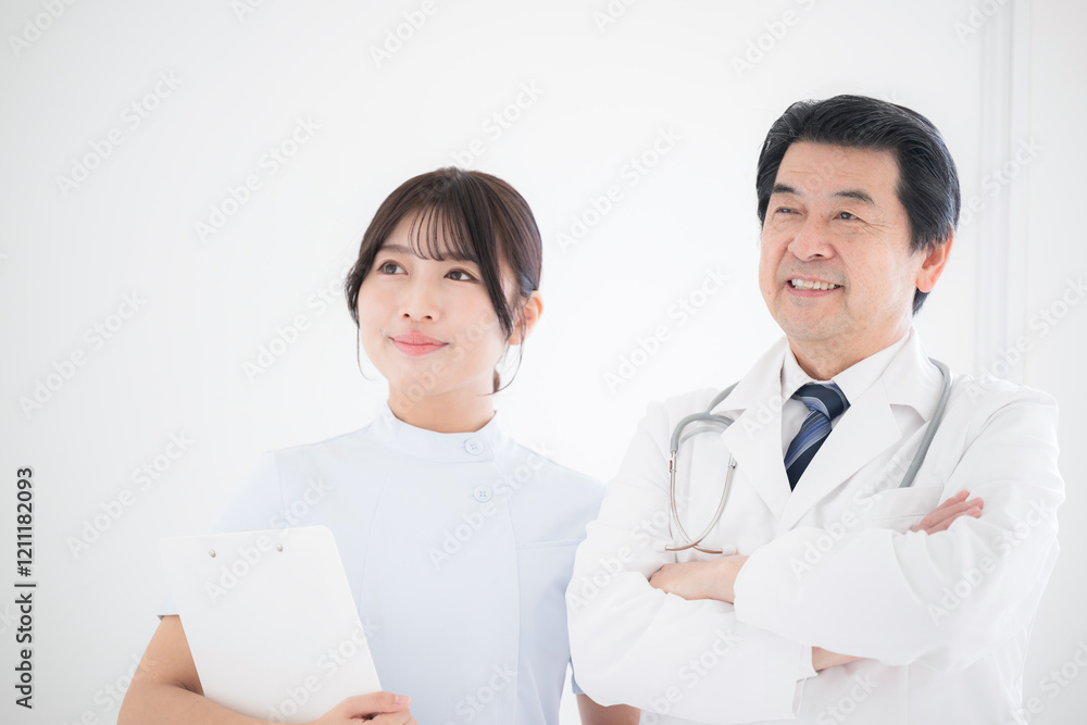 Veteran doctors and nurses standing with smiles on their faces, looking to the future and hope. Veteran doctors and nurses standing with smiles on their faces, looking to the future and hope.