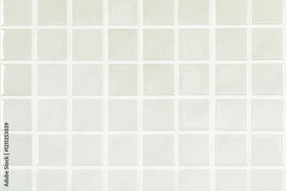 A grid of light-colored tiles arranged in even squares, creating a clean and minimalistic surface. A grid of light-colored tiles arranged in even squares, creating a clean and minimalistic surface.