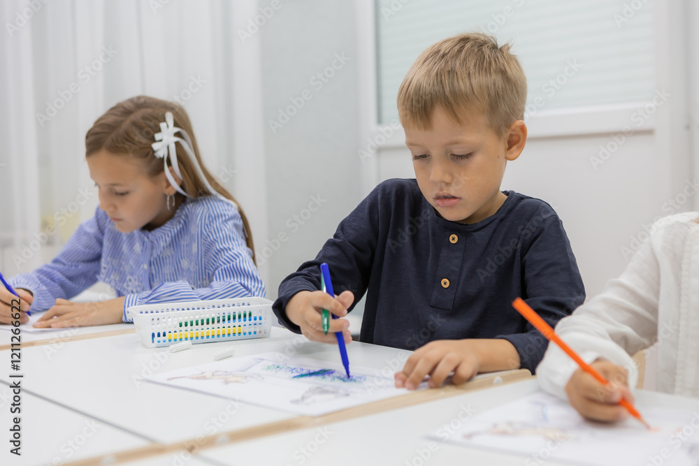 children with a teacher at a kindergarten class children with a teacher at a kindergarten class