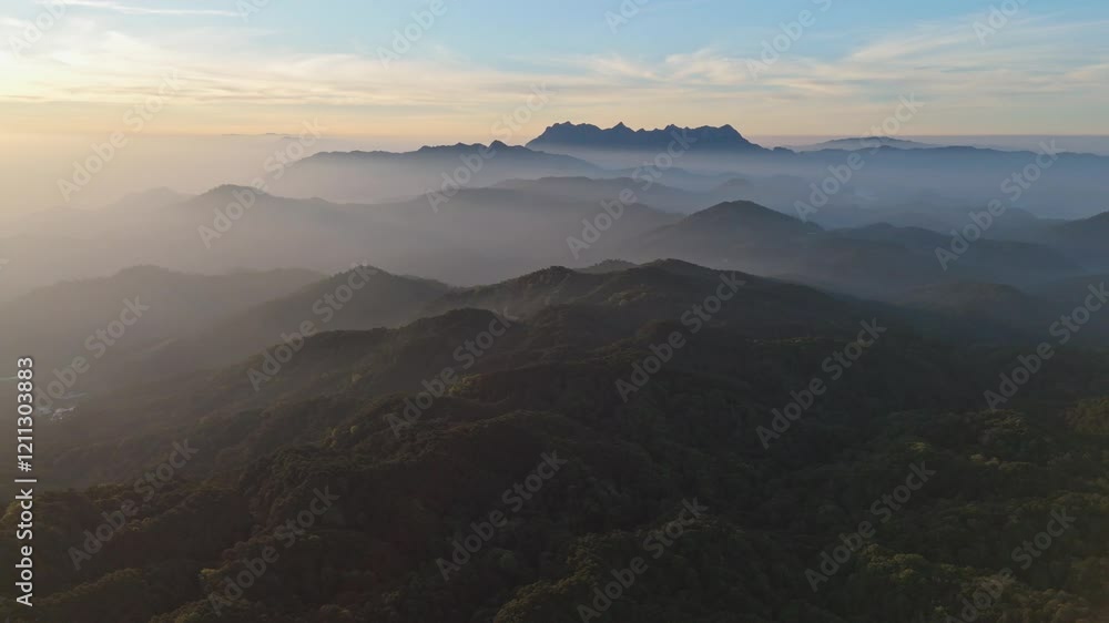 Aerial view foggy mountain forest landscape with morning colorful sunrise sky. (Doi Luang Chiang Dao) thailand . nature background. Aerial view foggy mountain forest landscape with morning colorful sunrise sky. (Doi Luang Chiang Dao) thailand . nature background.