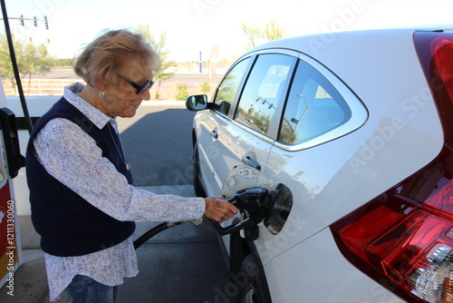 Senior Woman Pumping Her Own Gas