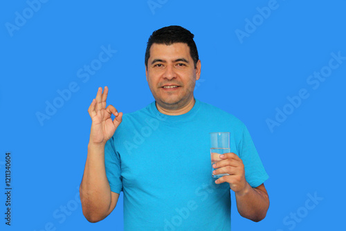 40-year-old dark-skinned Latin man recommends drinking water to stay hydrated and eliminate toxins photo