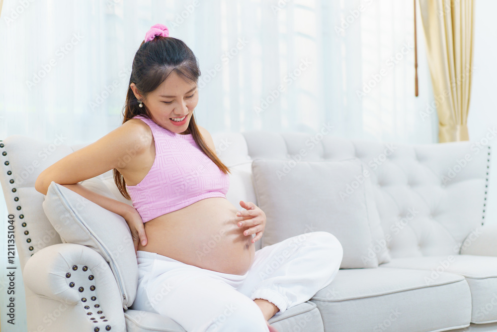 Asian pregnant woman relaxing at home. Asian pregnant woman relaxing at home.