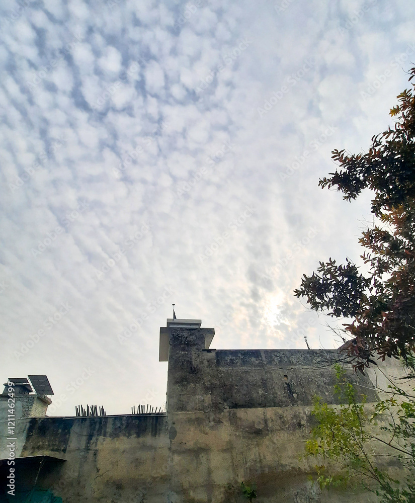 Ancient castle on a hill with a cloudy sky and sunset in the background Ancient castle on a hill with a cloudy sky and sunset in the background