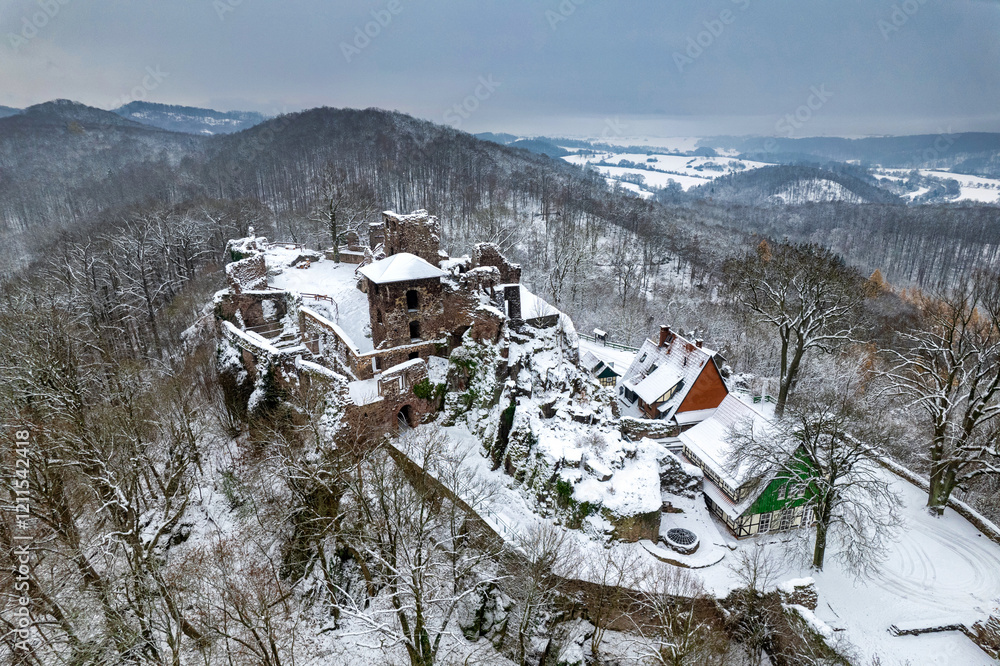 Aerial view ruins of old castle. Winter. Ruin of Hohnstein Castle, Harz mountains, Germany.