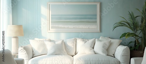 Cozy beach-themed living room featuring a white sofa with plush pillows against a light blue wall, framed ocean painting and soft lamp on side. photo