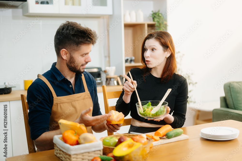 Couple cooking at home. young couple cooking together with Bread and fruit fresh vegetables, embracing healthy eating Couple cooking at home. young couple cooking together with Bread and fruit fresh vegetables, embracing healthy eating
