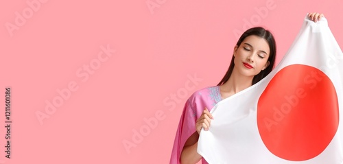 Beautiful young woman holdi...