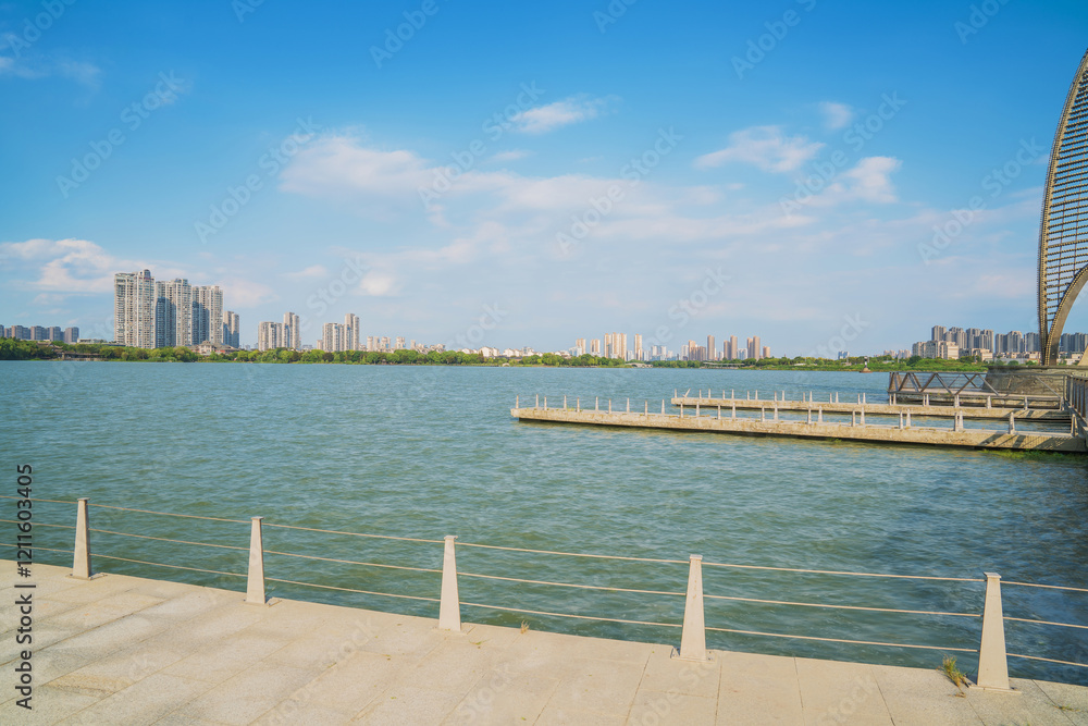 Fototapeta premium The skyline of modern urban buildings and the scenery of the Taihu Lake Lake in Wuxi, Jiangsu Province, China will be built on April 1, 2024