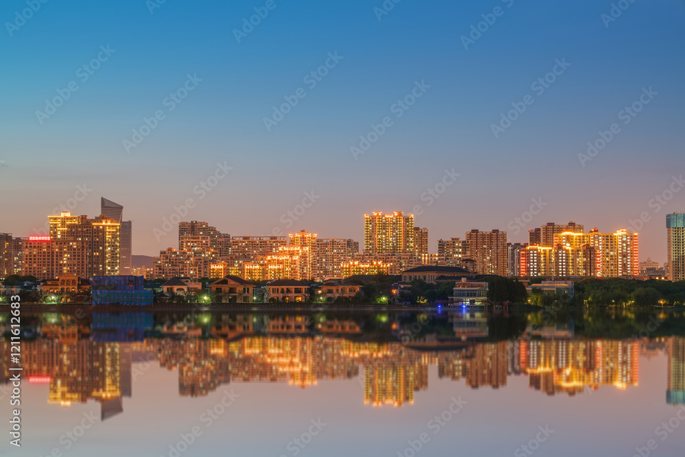 Obraz premium The skyline of modern urban buildings and the scenery of the Taihu Lake Lake in Wuxi, Jiangsu Province, China will be built on April 1, 2024