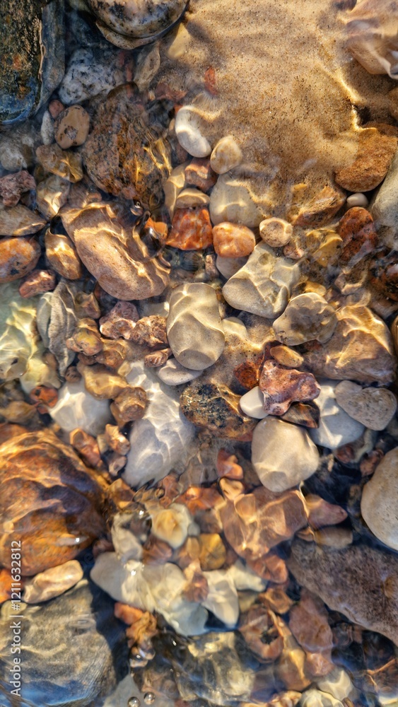 Vibrant River Pebbles in Clear Flowing Water Vibrant River Pebbles in Clear Flowing Water