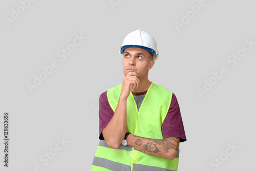 Thoughtful male engineer on...