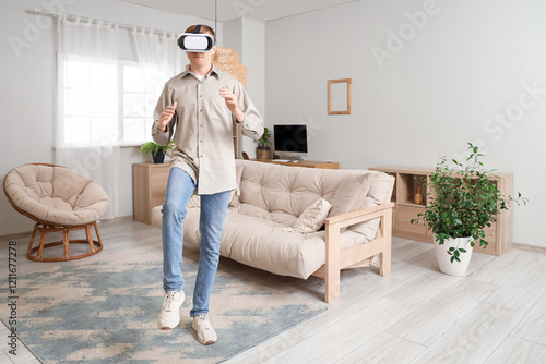 Young man in VR glasses at ...