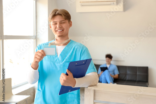 Male medical intern with ba...