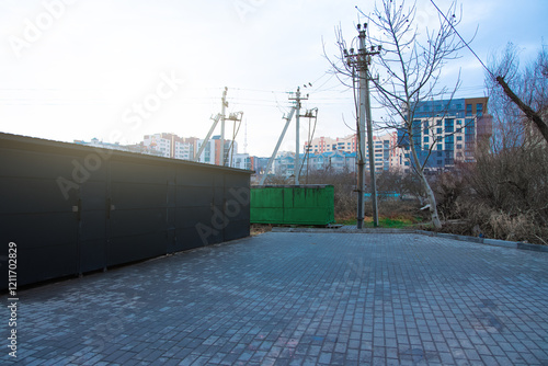 poor city street tile floor third world region space with garages and living houses urban cement and garbage view in dramatic lighting photo