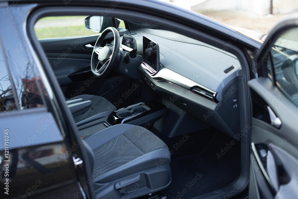 Prestige modern car. Inside car interior with front leather seats, steering wheel, windows, console, gear shift, electric buttons, digital speedometer. Luxury car interior. Car detailing series Prestige modern car. Inside car interior with front leather seats, steering wheel, windows, console, gear shift, electric buttons, digital speedometer. Luxury car interior. Car detailing series