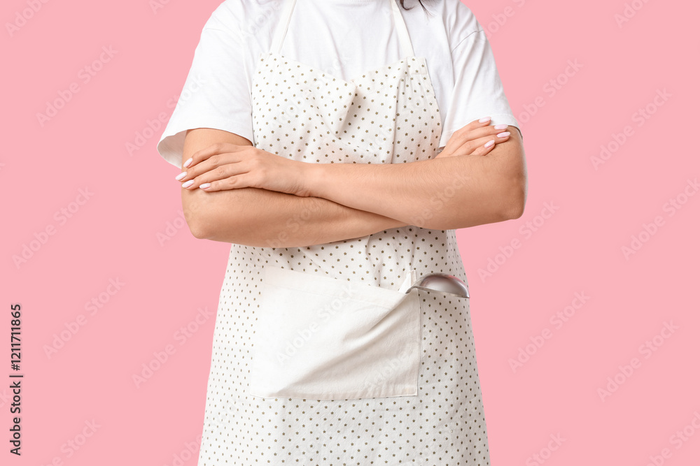Young woman in apron on pink background, closeup Young woman in apron on pink background, closeup