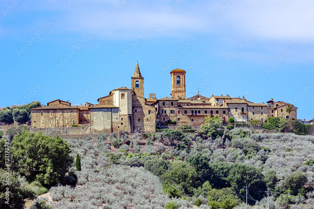 Collemancio, a historic hamlet in Cannara, Umbria, showcases its medieval architecture against a backdrop of rolling hills and olive groves. Village Collemancio - Italian national heritage