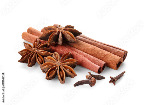 Star anise with cinnamon sticks and cloves on white background photo