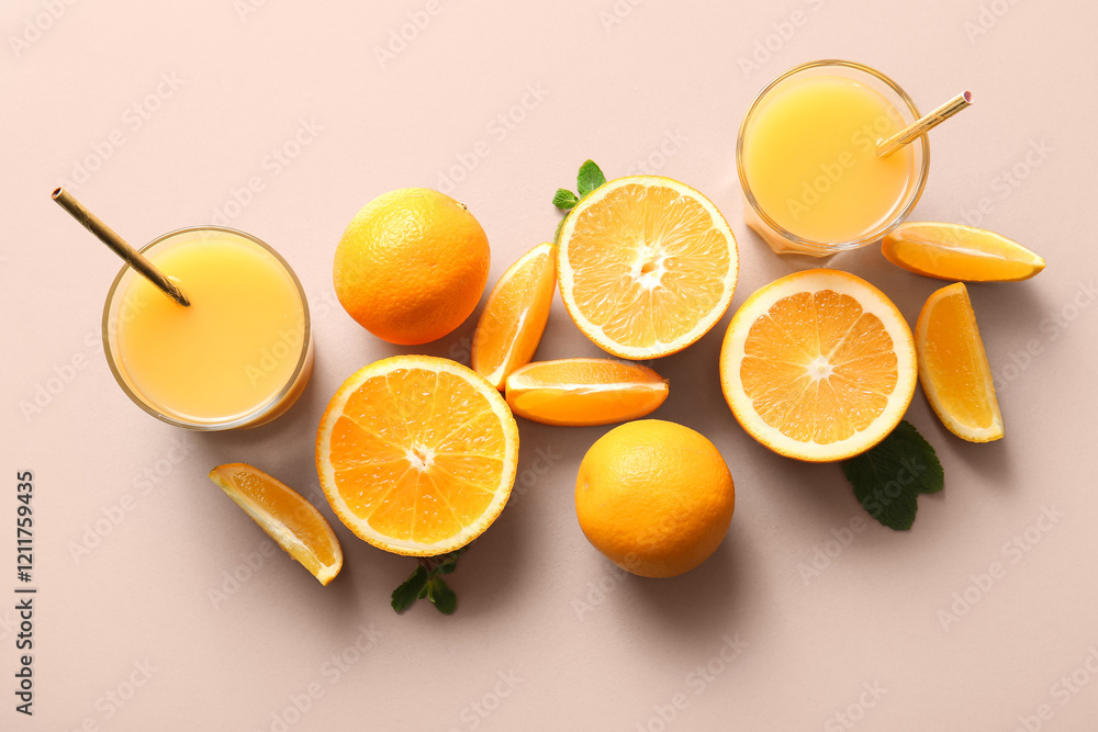 Glasses of fresh orange juice with mint and fruits on light background Glasses of fresh orange juice with mint and fruits on light background