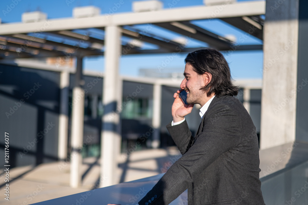 Confident Man On The Phone Making A Business Call In A Corporate Environment, Office Building Background, CEO Giving A Professional Call In A Leadership Role Confident Man On The Phone Making A Business Call In A Corporate Environment, Office Building Background, CEO Giving A Professional Call In A Leadership Role