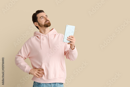 Handsome man with tablet co...