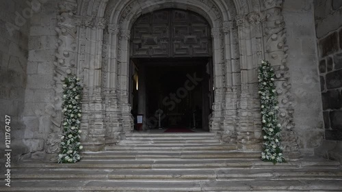 Wallpaper Mural Grand stone church entrance adorned with tall floral arrangements on each side of the stairs Torontodigital.ca