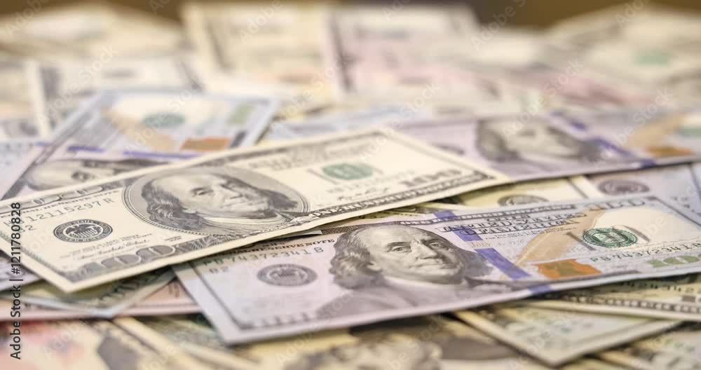 Dollar bills - cash money, dollar banknotes are falling on the table. Close up of cash money background, good earnings Dollar bills - cash money, dollar banknotes are falling on the table. Close up of cash money background, good earnings