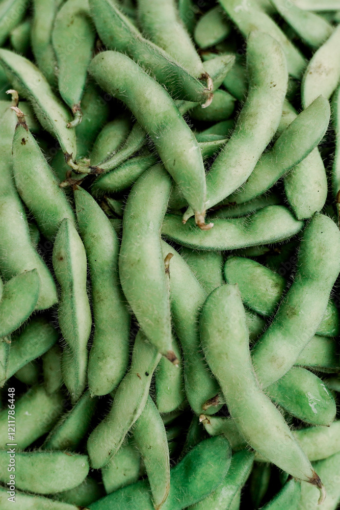 Fresh edamame pods as background, closeup view Fresh edamame pods as background, closeup view