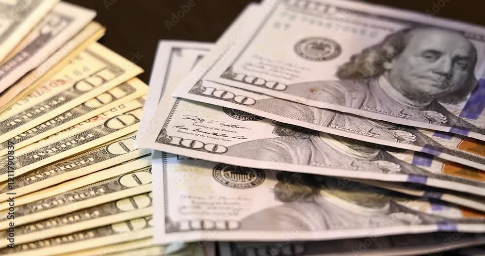 Counting dollar bills. Men's hands are holding and counting dollar bills - cash money, dollar banknotes on the table. Close up of cash money background, good earnings Counting dollar bills. Men's hands are holding and counting dollar bills - cash money, dollar banknotes on the table. Close up of cash money background, good earnings