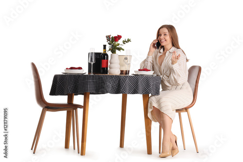 Young woman talking by mobi...