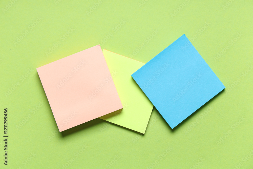 Different blank sticky notes on green background Different blank sticky notes on green background