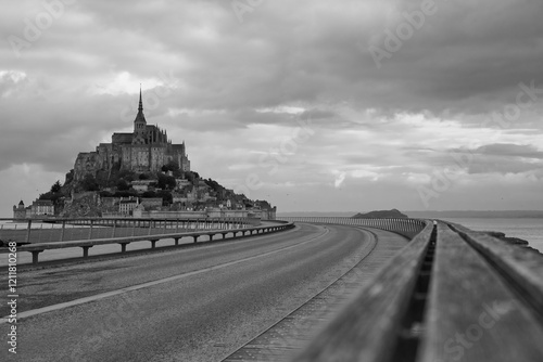 Le Mont Saint-Michel island with sheep and clouds, Normandy, France. France, Normandy, Manche department, Bay of Mont Saint-Michel.