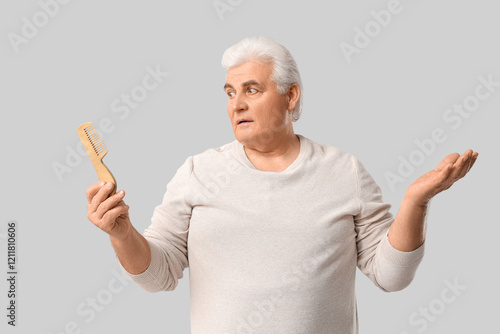 Worried senior man with hai...
