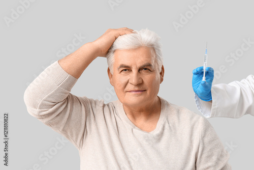 Senior man with hair loss p...