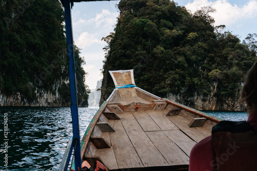 the bow of a long boat on a lake in thailand