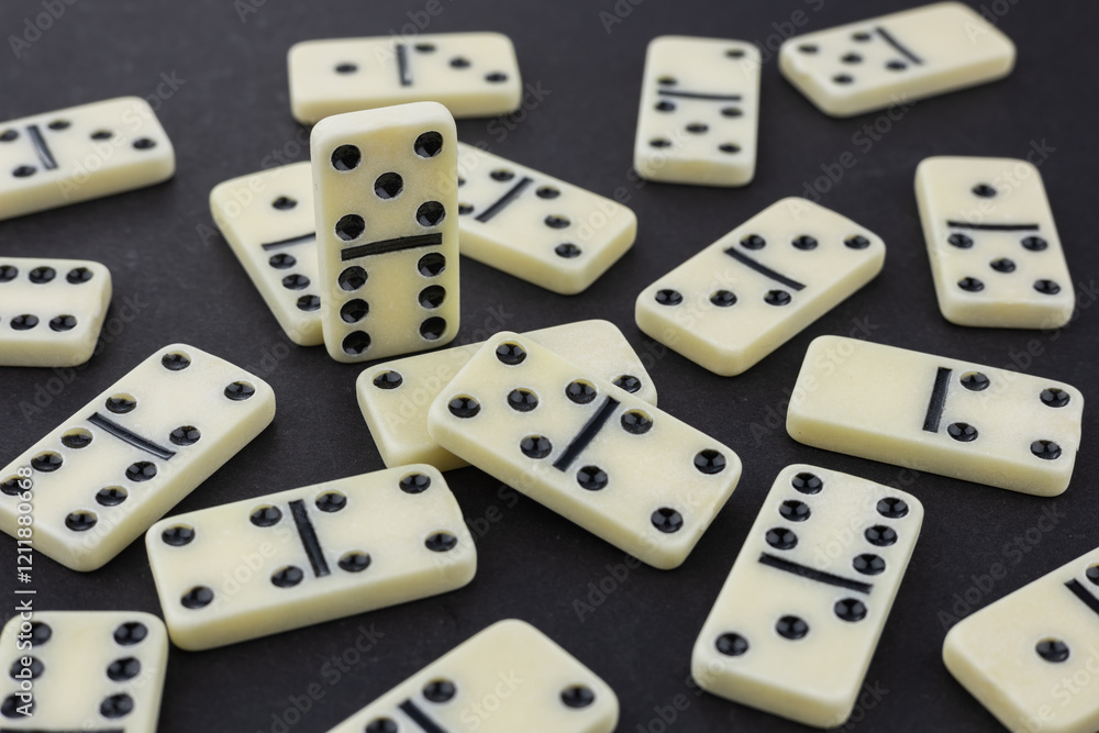 pile of white domino stones dark background pile of white domino stones dark background
