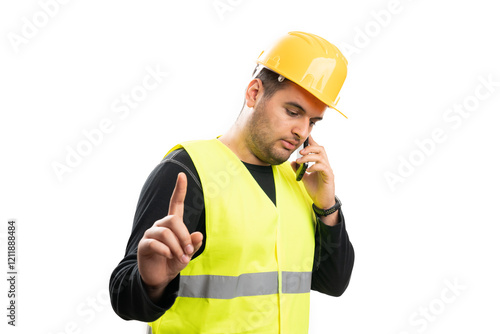 Busy construction worker talking on phone making wait gesture