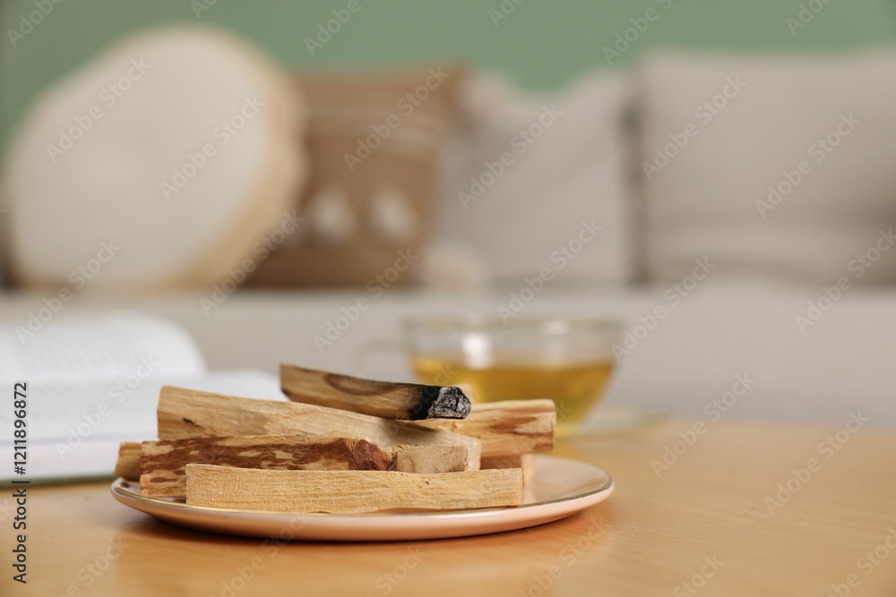 Palo santo sticks and burnt one on wooden table indoors, space for text Palo santo sticks and burnt one on wooden table indoors, space for text