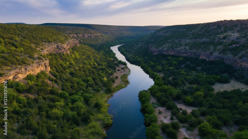 Aerial drone view of forested canyon with small river running through it Aerial drone view of forested canyon with small river running through it