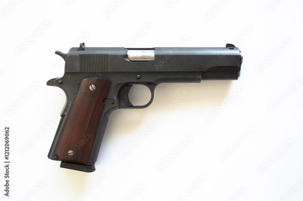 Black metal pistol. Wood grip. Right side view. Empty white background. Loaded. Detailed Black metal pistol. Wood grip. Right side view. Empty white background. Loaded. Detailed