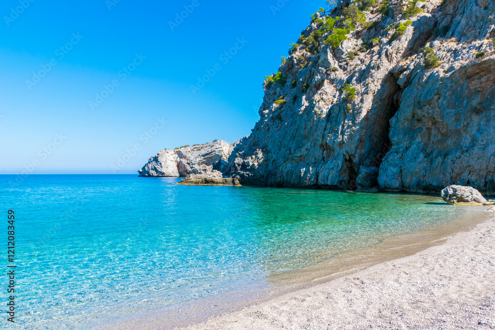 White pebbled Achata Beach with turquoise sea on Karpathos Island, Greece White pebbled Achata Beach with turquoise sea on Karpathos Island, Greece
