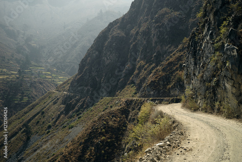 Dirt road in mountains photo